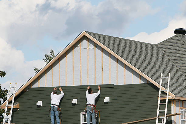 Professional Vinyl Siding technician working in Aurora, IN